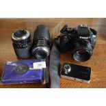 Police recovered items - A Canon EOS 1100D digital camera complete with two lenses, a Polaroid
