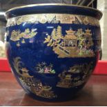 A Carlton Ware powder blue ground jardiniere with gilded and enamelled Chinoiserie decoration