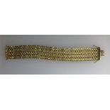 An 18ct yellow gold fancy link mesh strap bracelet