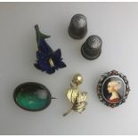 A Kingfisher feather brooch and other items