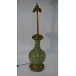 A Chinese porcelain brass mounted and celadon glazed table lamp, late Qing or Republic period
