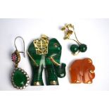 A malachite pendant carved as an elephant