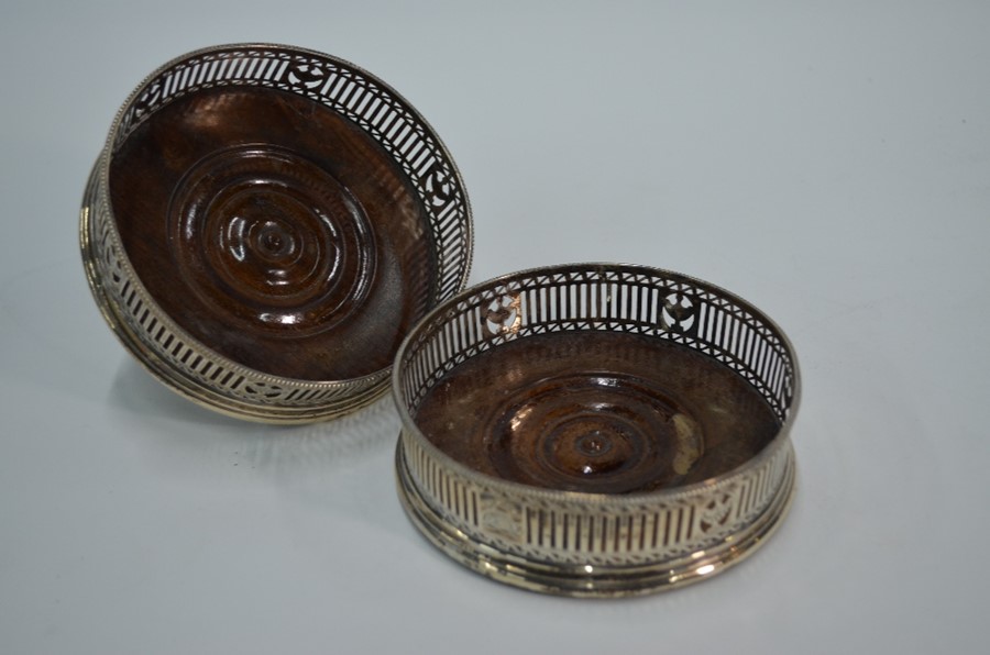 A pair of George IV bottle coasters