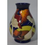 A modern Moorcroft Pottery baluster vase decorated with mushrooms