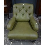 A late 19th century buttoned leatherette upholstered armchair