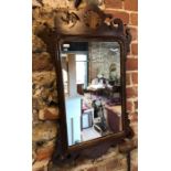 A 19th century mahogany fret cut wall mirror, the crest centred by a gilt shell deisgn