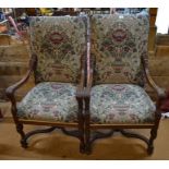 A pair of continental walnut framed open armchairs