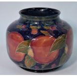 A William Moorcroft vase decorated in the 'Pomegranate' pattern