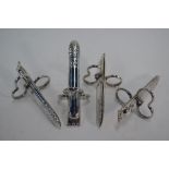 An unusual set of four pairs of electroplated asparagus-eater's tongs