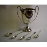 An Edwardian silver two-handled trophy cup and various spoons