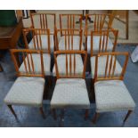 A set of ten Heals hardwood dining chairs comprising eight side chairs and a pair of carvers