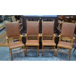 An unusual set of four Arts & Crafts period oak framed high back elbow chairs (4)