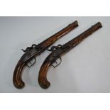 A near-matched pair of early 19th century Continental percussion pistols