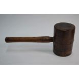 A large turned wood mallet