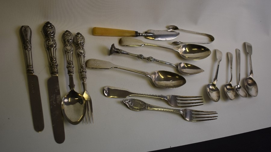 A cased set of twelve silver teaspoons with tongs etc.