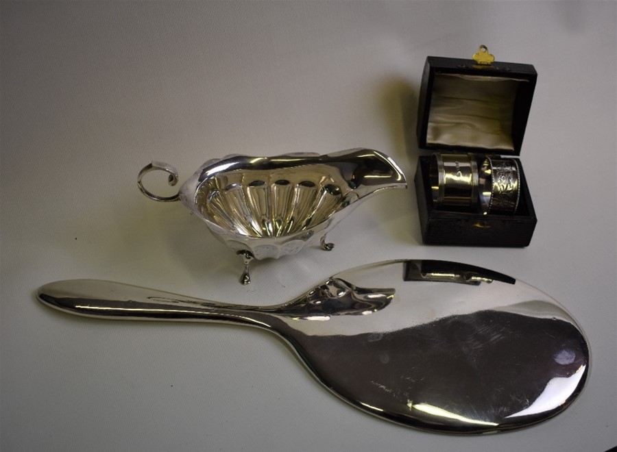 A plain silver hand-mirror etc.