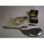 A plain silver hand-mirror etc.