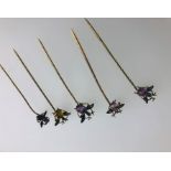 Five various insect stick pins set amethyst and citrine