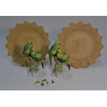 Two 19th century bisque plates and two parrot models