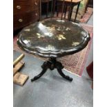 A Victorian papier mache and mother of pearl inlaid occasional table