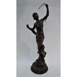 A brown patinated bronze figure group of Diana the Huntress with hound