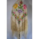 A Chinese embroidered fringed shawl and an embroidered silk georgette panel