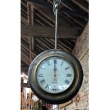 A vintage two sided hanging clock, the 29 cm white dials stencilled 'George V, Jays of London'