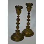 A pair of 19th century cast brass ornate baluster candlesticks