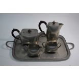 A 'Warric' for Liberty planished pewter four piece tea set and tray