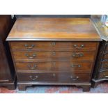 A 19th century mahogany chest of four long graduated cock-beaded drawers