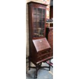 A walnut bureau bookcase of small proportions