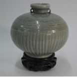 A 16th century Sawankhalok celadon stoneware vessel of globular form