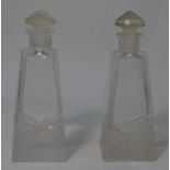 A pair of Art Deco square based scent bottles and stoppers