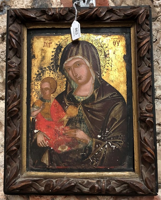 An antique Coptic icon, Madonna and Child, painted and gilded on panel
