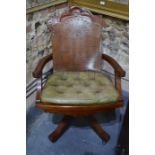 A late 19th/20th century American 'office' reclining swivel chair, walnut