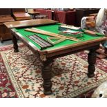 An antique oak metamorphic billiard / dining table, the wind action adjustable height top with slate