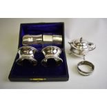 A cased pair of silver napkin rings