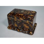 A Victorian tortoiseshell tea caddy