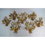 A set of four floral design gilt metal twin-handle wall sconces