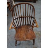 An antique cottage elm seat Windsor elbow chair