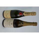 Two vintage bottles of Champagne