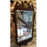 A 19th century ho-ho crested fret framed mirror (damaged)