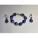 A blue enamel bracelet and earring set