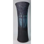 Daum, Nancy - A tall glass vase overlaid and acid etched with a wooded lake scene