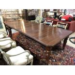 A Victorian walnut wind-out extending dining table, with two insert leaves
