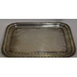 A rectangular silver pin tray