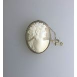 An antique oval shell cameo brooch of a classical god