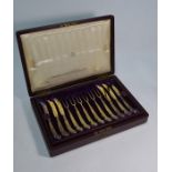 A Victorian Asprey case fitted with set of silver gilt triffid teaspoons