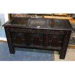 A 17th century joint oak coffer with carved frieze and stiles