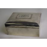 A silver cigar/cigarette box